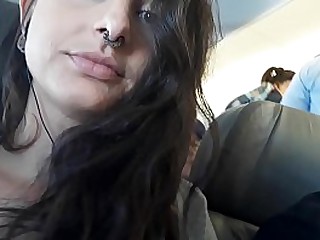 Hot babe masturbating inside the plane